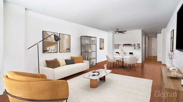 living room with hardwood / wood-style floors and ceiling fan