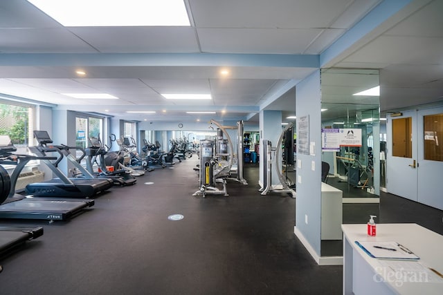 workout area with a paneled ceiling