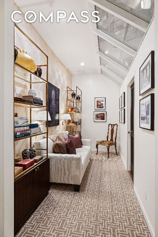 interior space featuring lofted ceiling and carpet floors