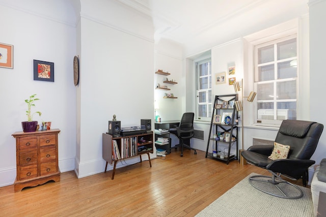 home office featuring light wood-style flooring and baseboards