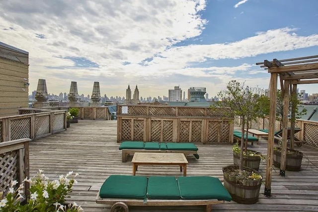 2109 Broadway Unit 902, New York City, NY 10023 - wooden terrace with a view of skyline and a pergola