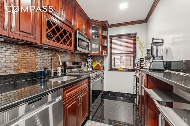 kitchen featuring crown molding, a sink, granite finish floor, stainless steel appliances, and decorative backsplash