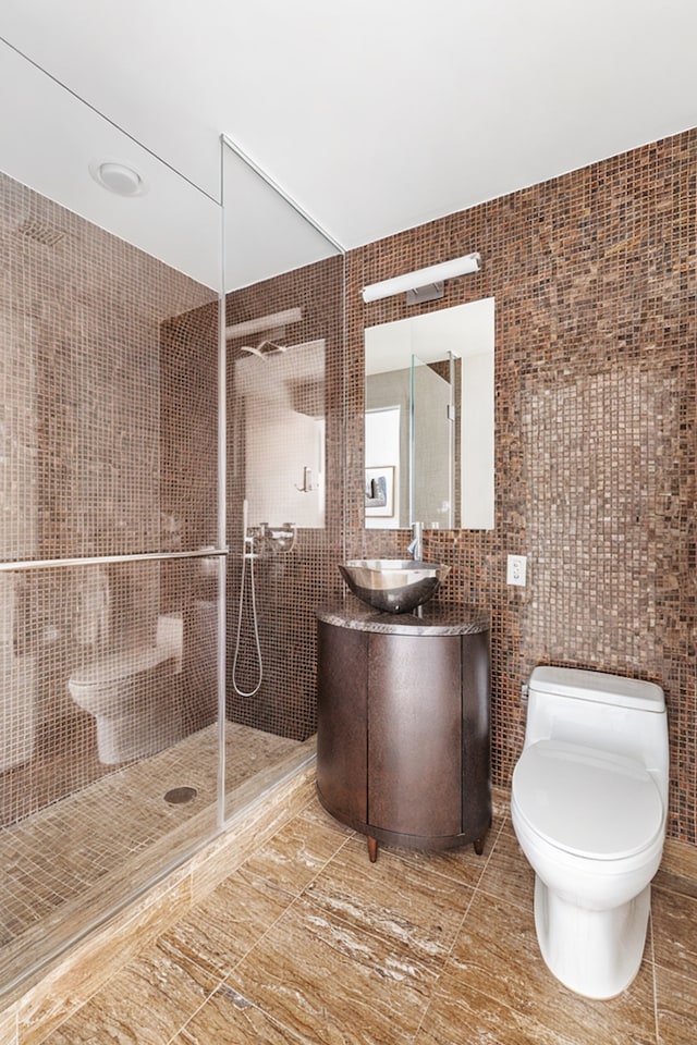 250 E 53rd St Unit 3004, New York City, NY 10022 - full bath featuring tile walls, vanity, a walk in shower, and tile patterned floors