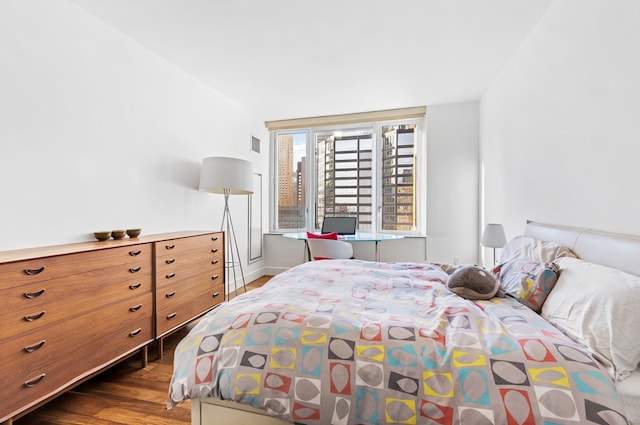 250 E 53rd St Unit 3004, New York City, NY 10022 - bedroom with dark wood finished floors