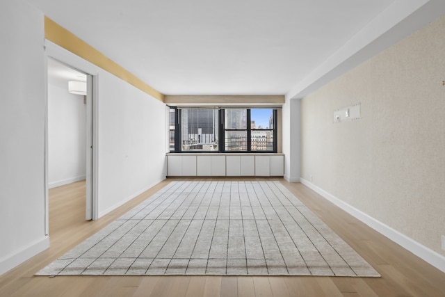 spare room with light wood-type flooring