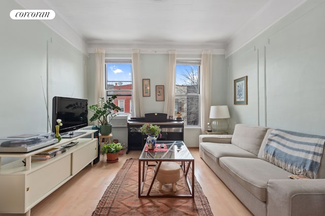 living room with light wood-type flooring and visible vents