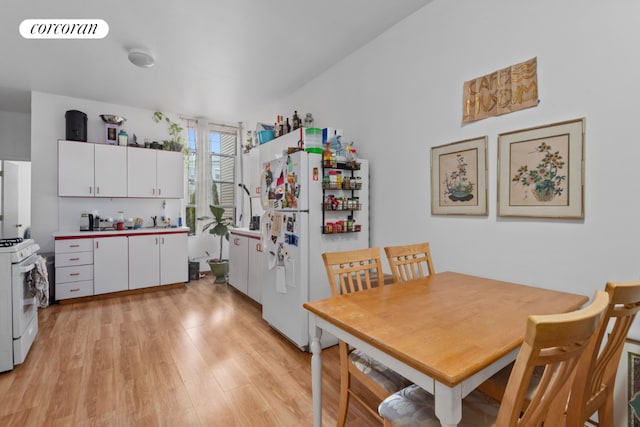 dining room with light wood-style flooring and visible vents