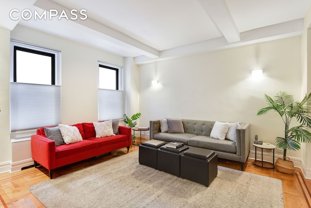 living area with beam ceiling and baseboards