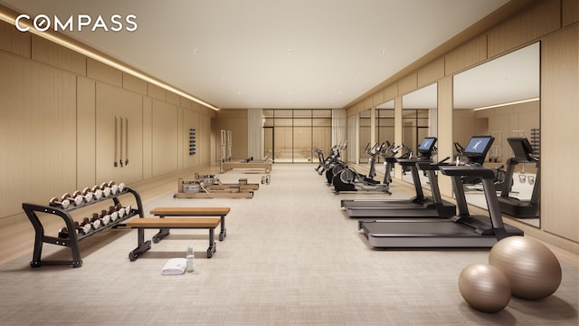 workout area with a decorative wall and carpet