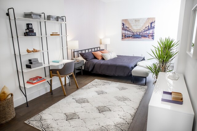 bedroom with wood finished floors