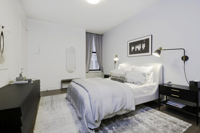 bedroom featuring wood finished floors