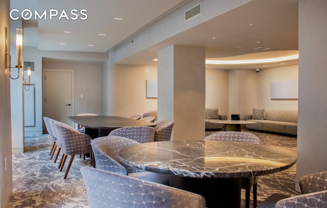 dining room featuring visible vents