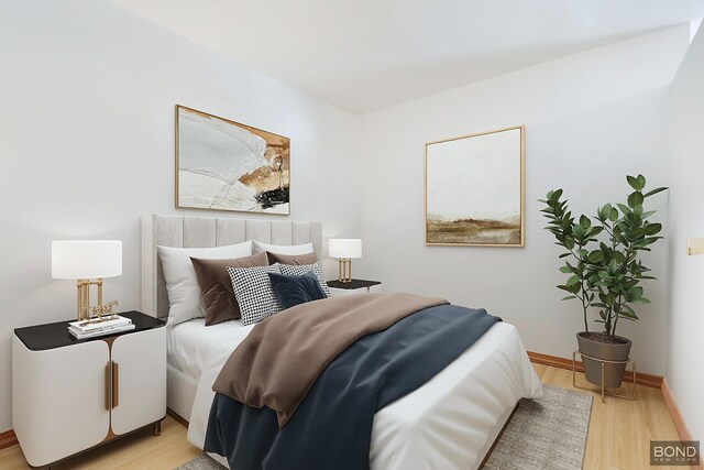 bedroom featuring light wood-style flooring and baseboards