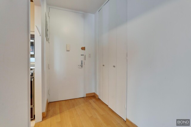 doorway to outside featuring light wood-type flooring