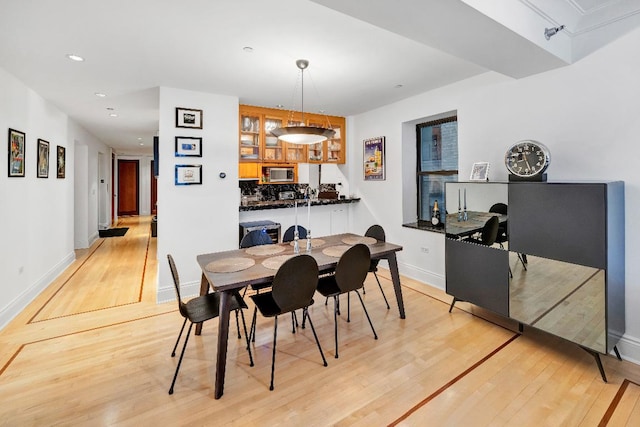 dining room with light wood-type flooring