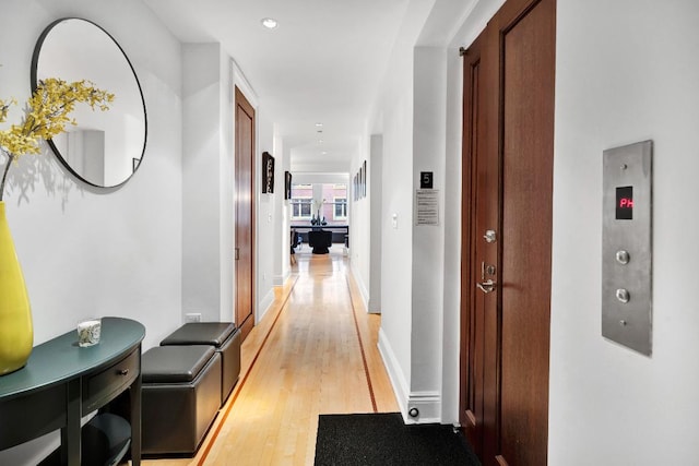 corridor featuring light wood-type flooring