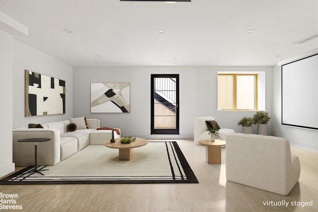 living room with visible vents and recessed lighting