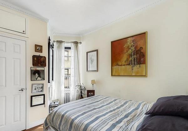 bedroom with crown molding