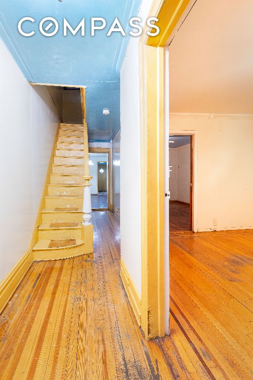 hallway with wood-type flooring