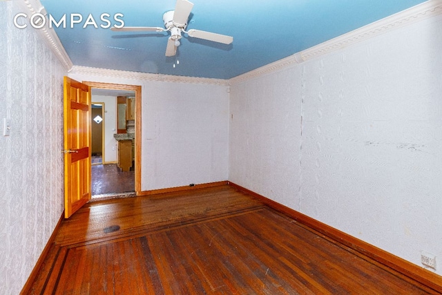 unfurnished room with crown molding, ceiling fan, and wood-type flooring