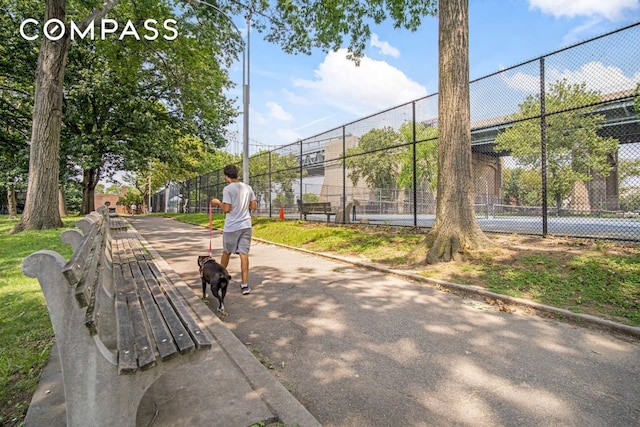 view of community featuring fence