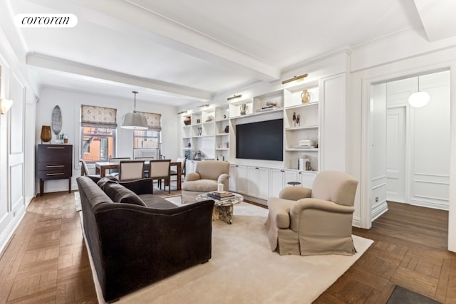 living room with beam ceiling, parquet flooring, and built in features