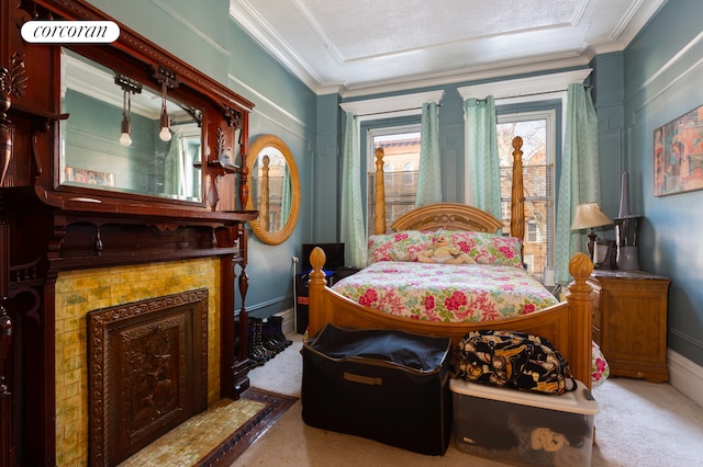 bedroom featuring ornamental molding, carpet flooring, and baseboards