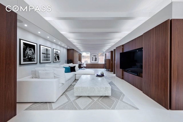 living area featuring recessed lighting and beamed ceiling