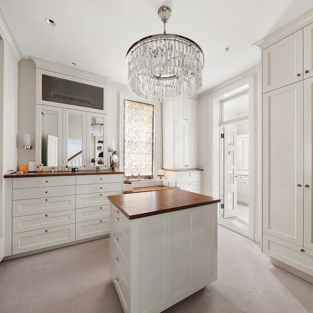 interior space featuring a chandelier and light carpet