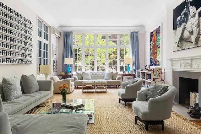 living room featuring a fireplace with flush hearth and a wall unit AC