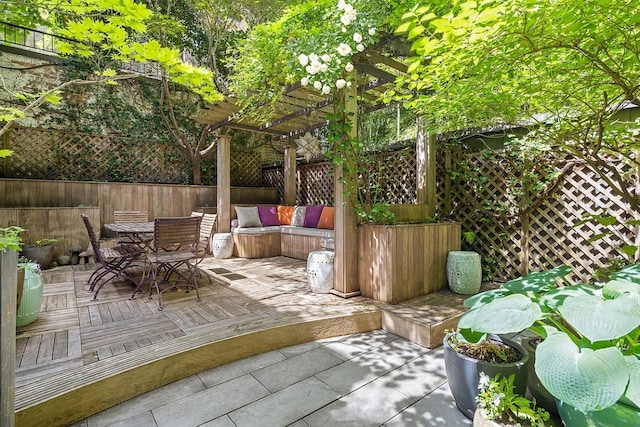 view of patio / terrace with an outdoor hangout area and a pergola