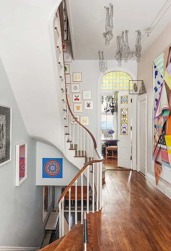 134 E 62nd St, New York City, NY 10065 - entryway featuring hardwood / wood-style floors, stairway, and a chandelier