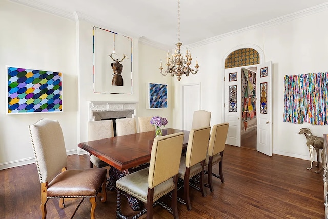 134 E 62nd St, New York City, NY 10065 - dining space featuring a chandelier, crown molding, dark wood-type flooring, baseboards, and a fireplace