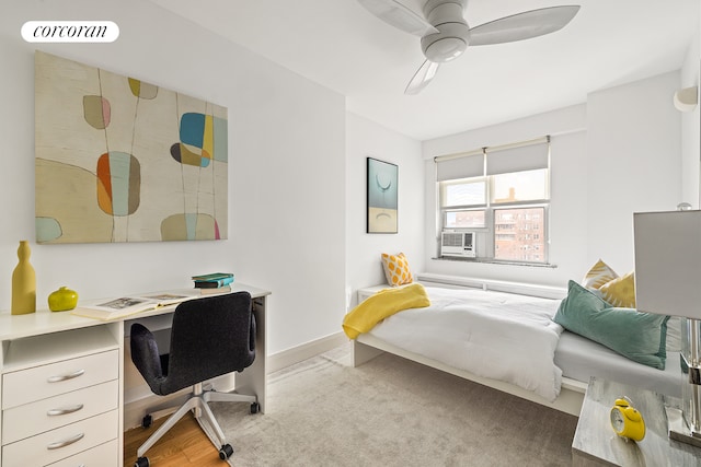 bedroom featuring ceiling fan and baseboards