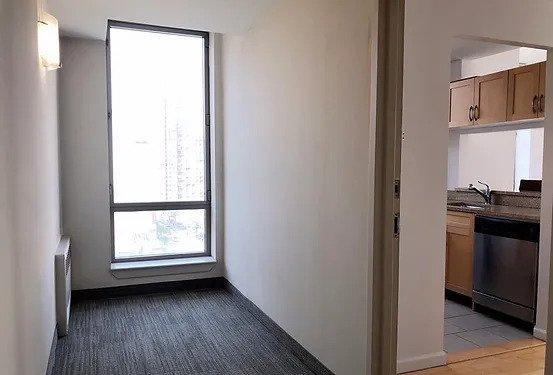hallway with a sink and radiator