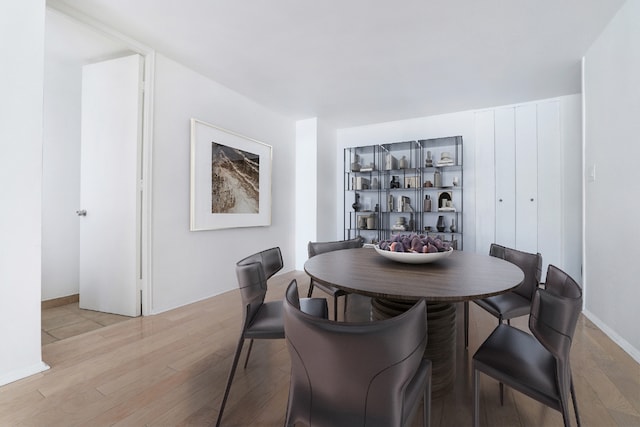 dining area with light wood-type flooring