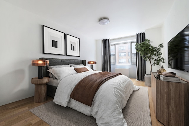 bedroom with wood finished floors