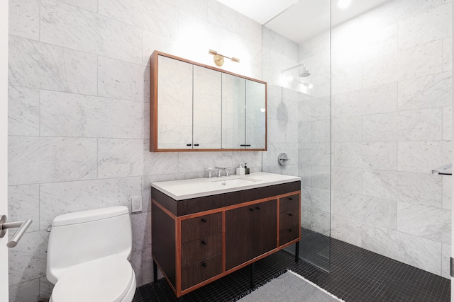 184 Kent Ave Unit B312, New York City, NY 11249 - full bathroom featuring tile walls, walk in shower, vanity, toilet, and tile patterned flooring