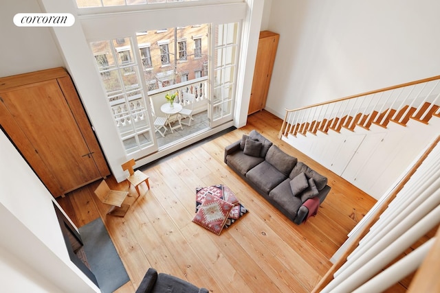 living area featuring stairway and hardwood / wood-style floors