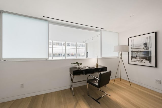 office featuring wood finished floors and baseboards