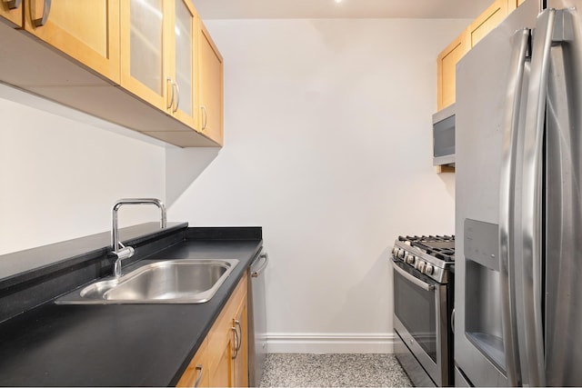 401 E 60th St Unit 5J, New York City, NY 10065 - kitchen with appliances with stainless steel finishes, dark countertops, light brown cabinetry, and glass insert cabinets