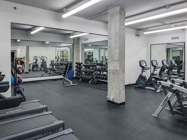 gym with decorative columns