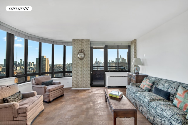 living area with visible vents and a view of city