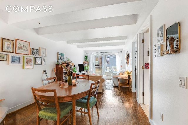 dining area featuring beam ceiling, dark hardwood / wood-style flooring, and french doors