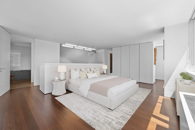 45 W 67th St Unit 27D, New York City, NY 10023 - bedroom featuring dark wood-style flooring