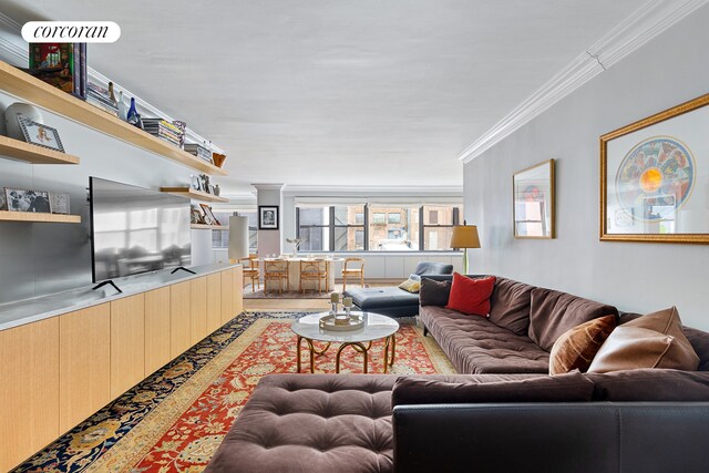 living room with ornamental molding