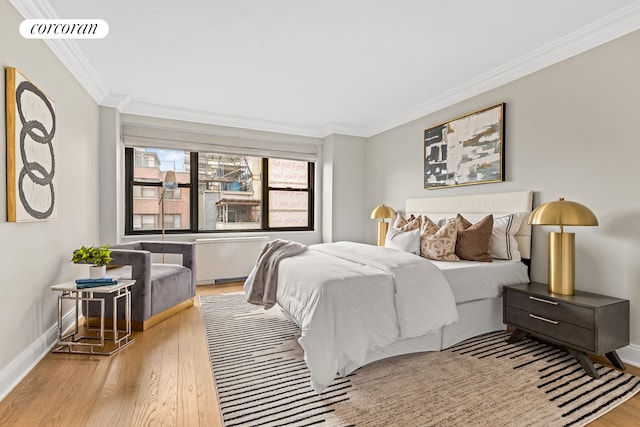 166 E 61st St Unit 8Mn, New York City, NY 10065 - bedroom featuring ornamental molding, wood finished floors, and baseboards