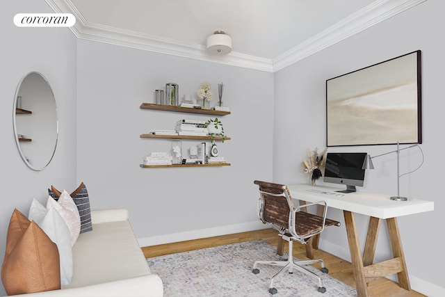 bedroom featuring visible vents, a barn door, wood finished floors, and ornamental molding