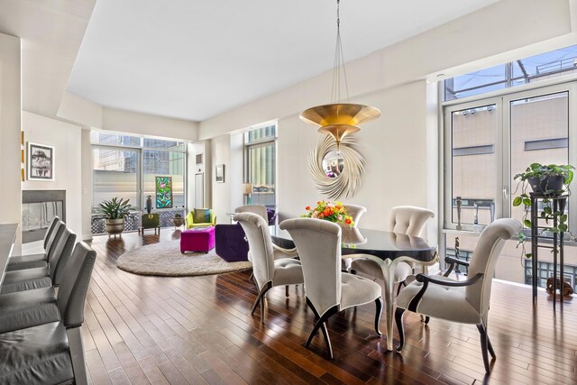 dining space with wood finished floors