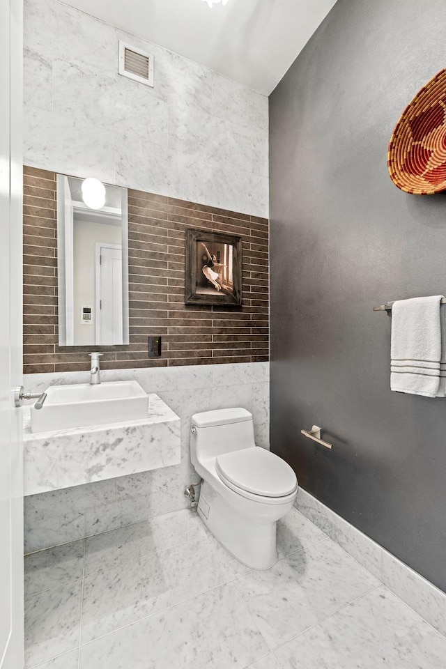 bathroom with toilet and a fireplace